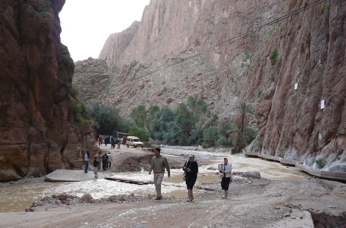 The narrow limestone walls of Todra Gorge with the road and river running through